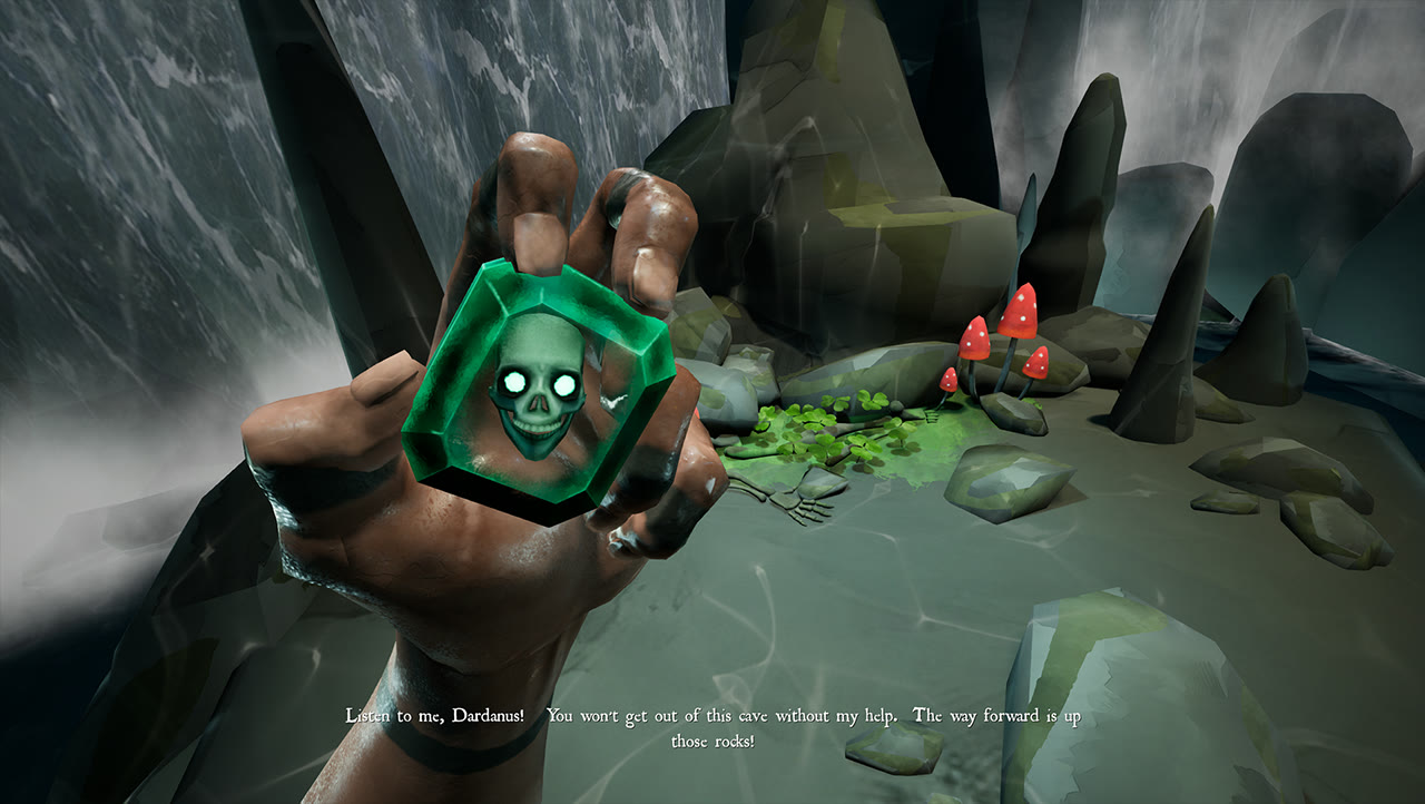 Grimhook gameplay: a first-person hand holds a glowing green skull amulet in a misty cavern