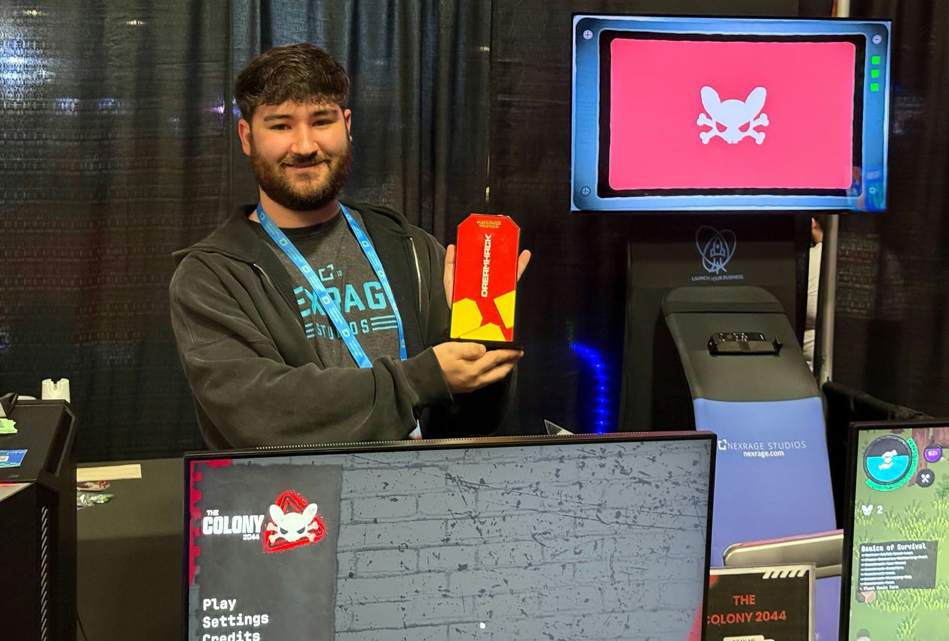 Jared holding the DreamHack Audience Choice award at The Colony 2044 booth